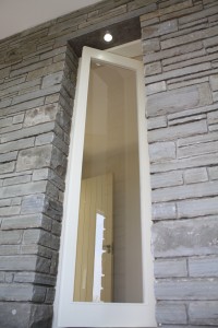 Liscannor stone wall with vertically rotating wardrobe window